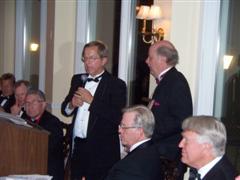 Paul Larson of Madison TOrske Klub presents plaque